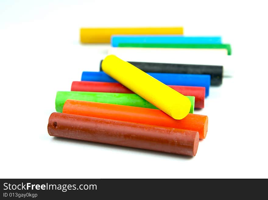 Oil pastels/crayons isolated against a white background