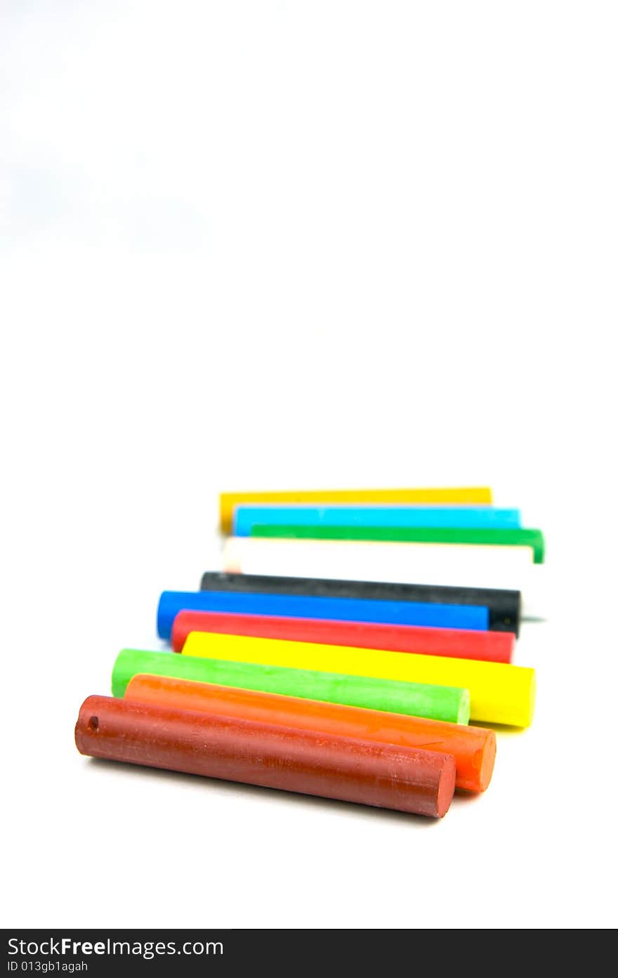 Oil pastels/crayons isolated against a white background