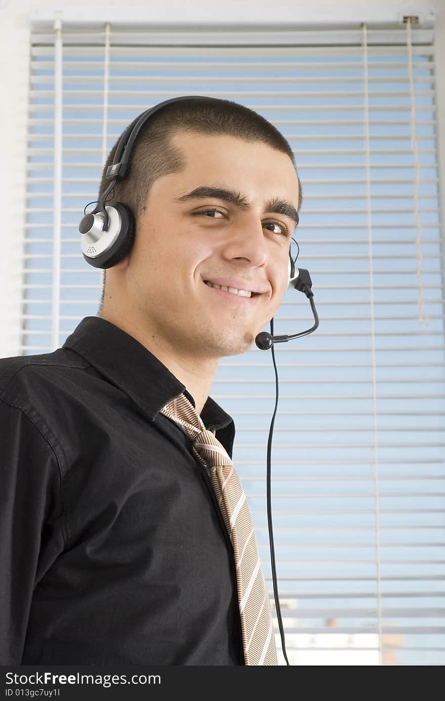 Young man with headphone talking. Young man with headphone talking