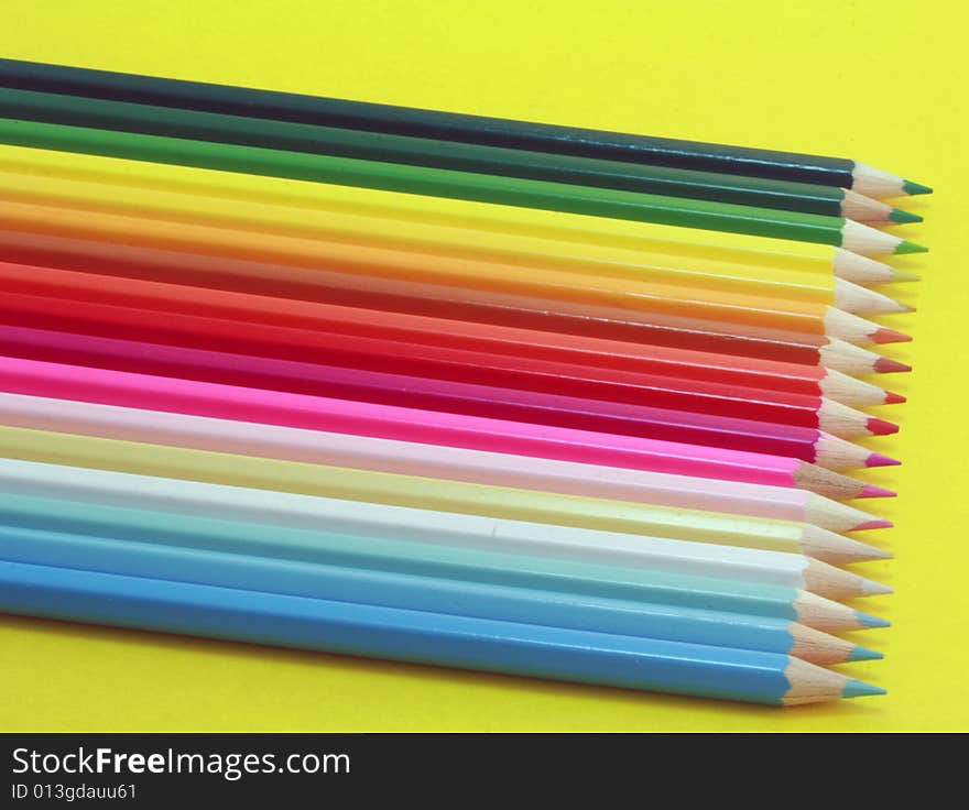 Crayons on the yellow background