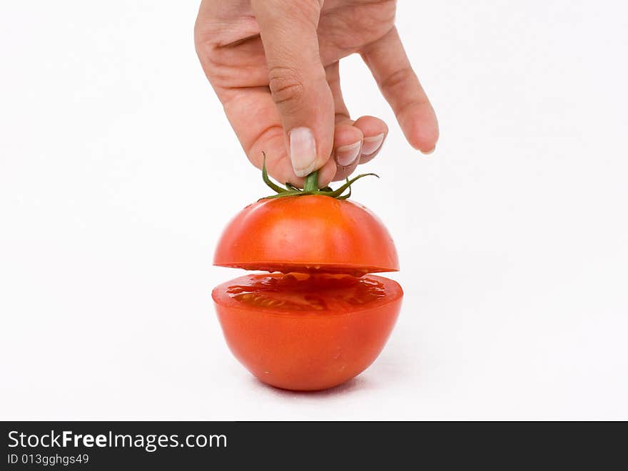 Cut tomato on a white background