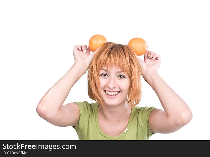 The young woman with red hair holds two oranges