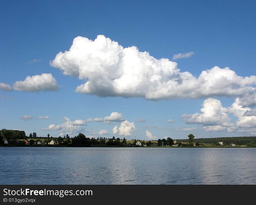 View Of River With Clouds In The Sky