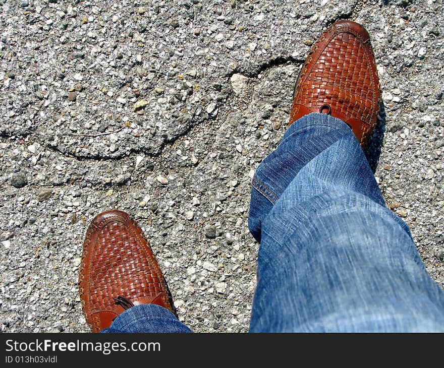 Man Standing On A Asphalt