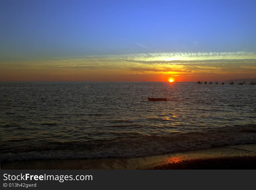 A sea in a blue at the sunset. A sea in a blue at the sunset