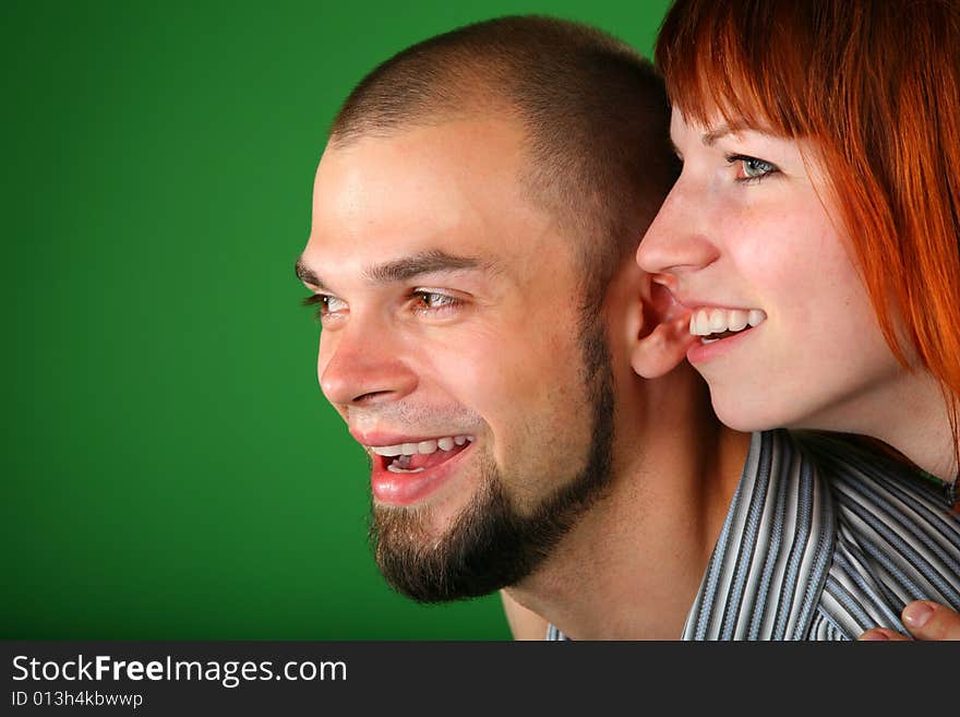 Beard red couple smile faces on a green