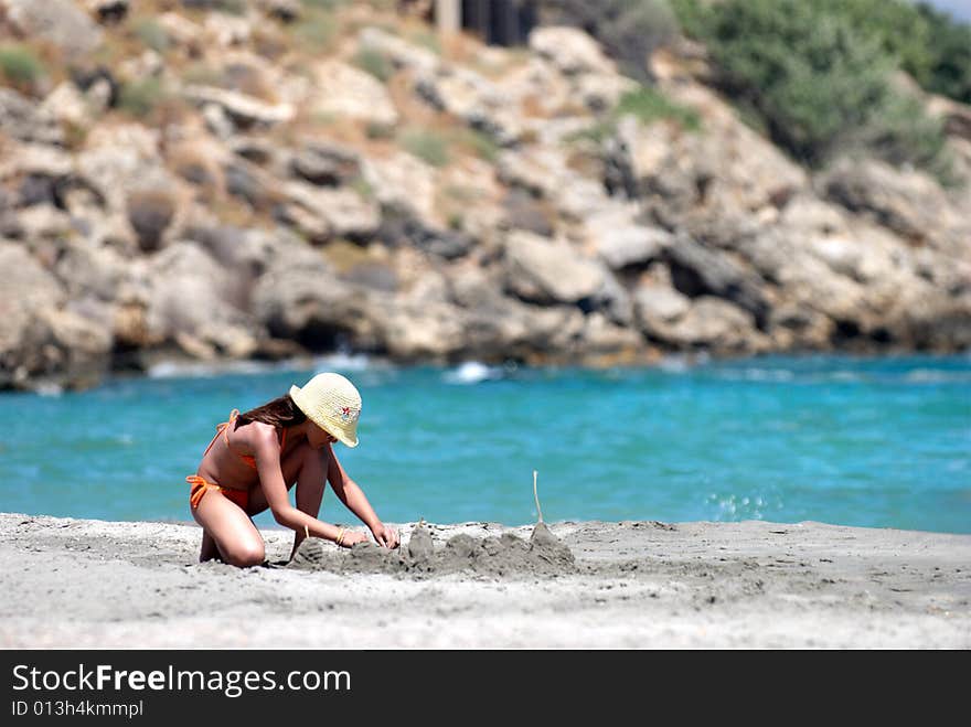 Small Girl On The Beach