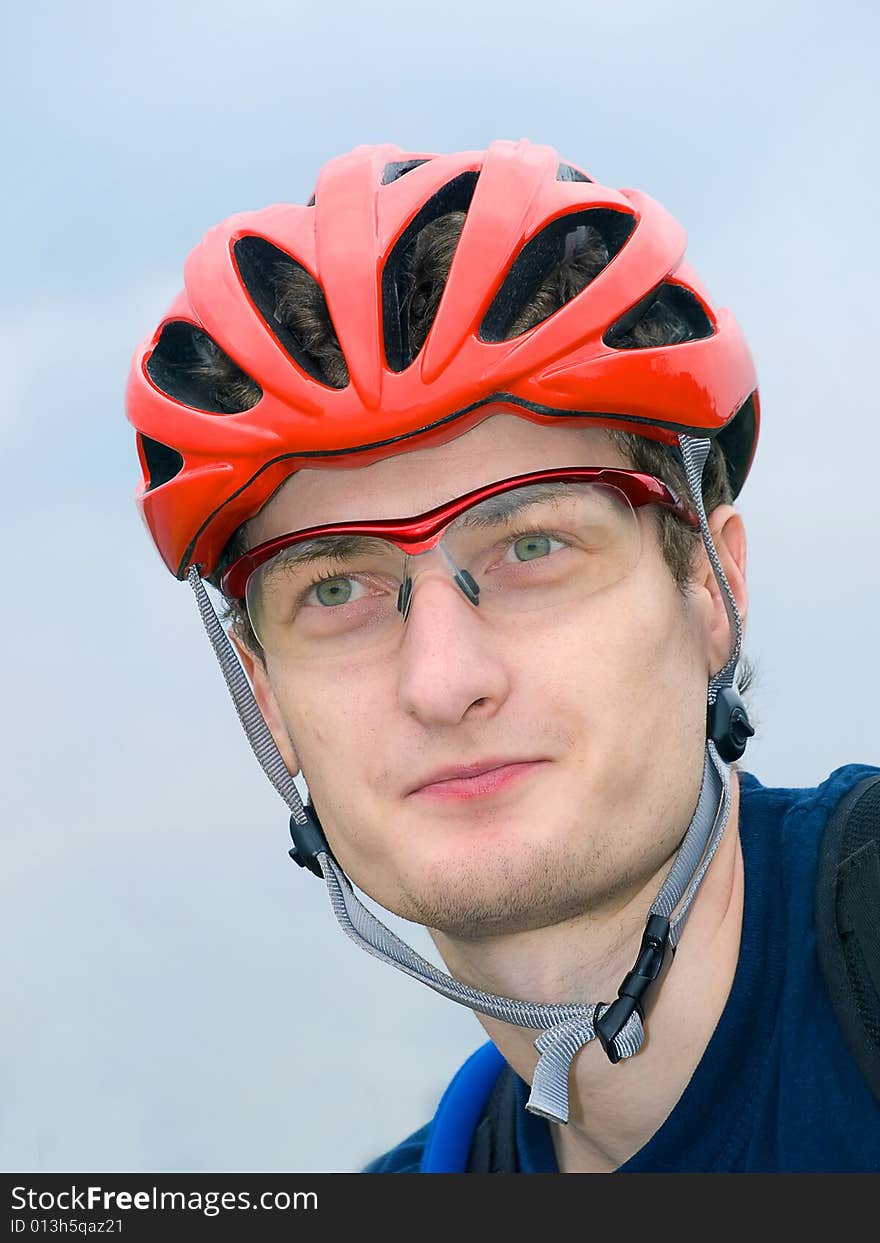 Portrait of cyclist in the protective helmet