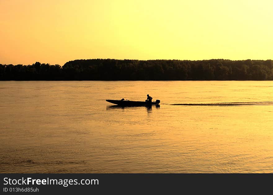 Fishing boat at the sunset