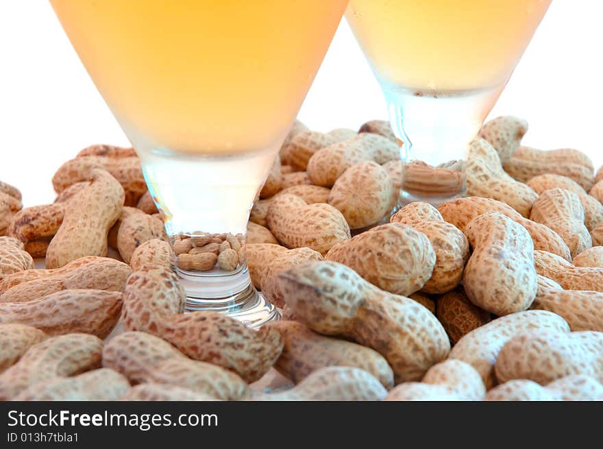 Beer in glass  and  snack - peanuts  in shells. Beer in glass  and  snack - peanuts  in shells.