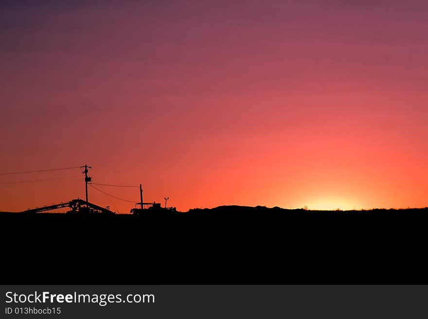 Sunset backlighting and silhouetting a rural landscape. Sunset backlighting and silhouetting a rural landscape.