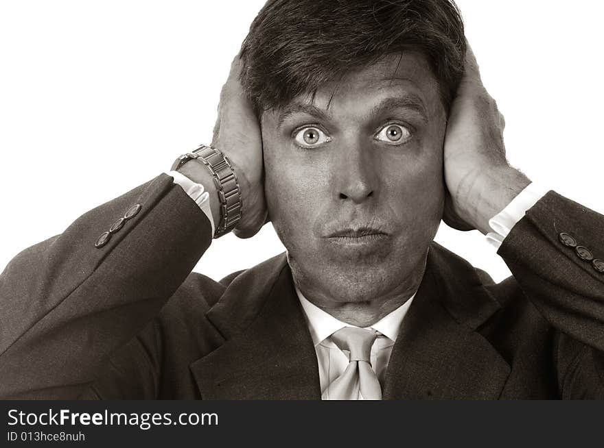 Portrait of a businessman with hands over his ears. Portrait of a businessman with hands over his ears