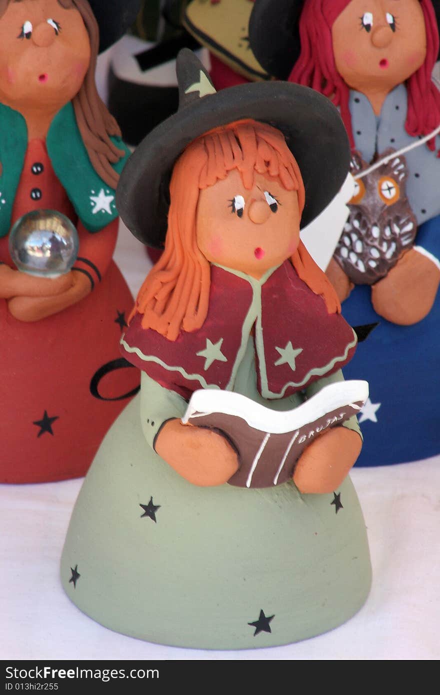 Typical cla figures of witches in a fair of clay in Majorca in Spain