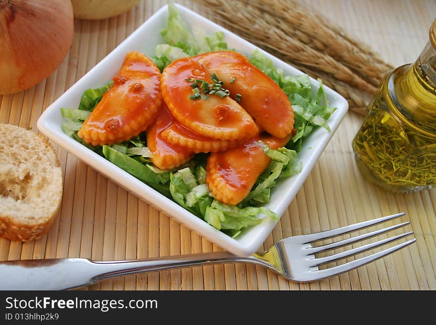 Fresh italian pasta with tomtoesauce and salad