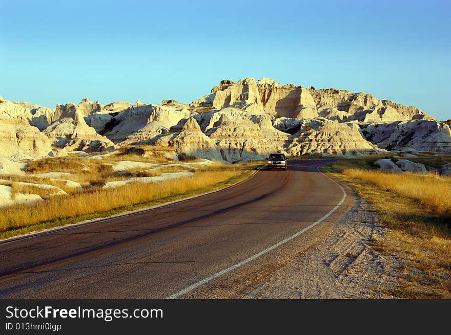 Driving through the Badlands National Park in South Dakota at Dusk.