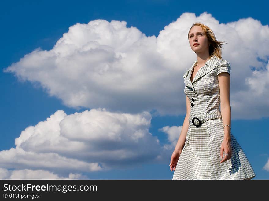 Girl On A Background Clouds