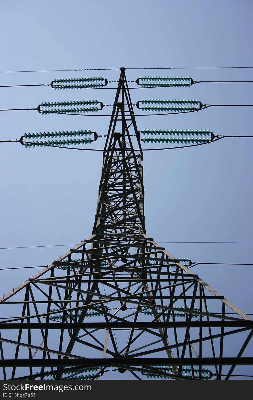 The intricate framework of a tower and wires carrying electricity. The intricate framework of a tower and wires carrying electricity