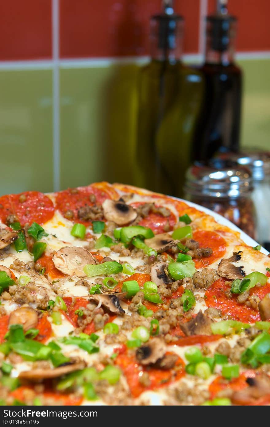 An image of pepperoni pizza with mushrooms and chives