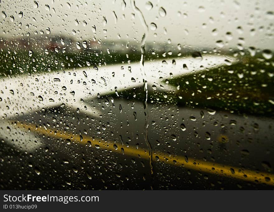 A view from airplane's window trough raindrops