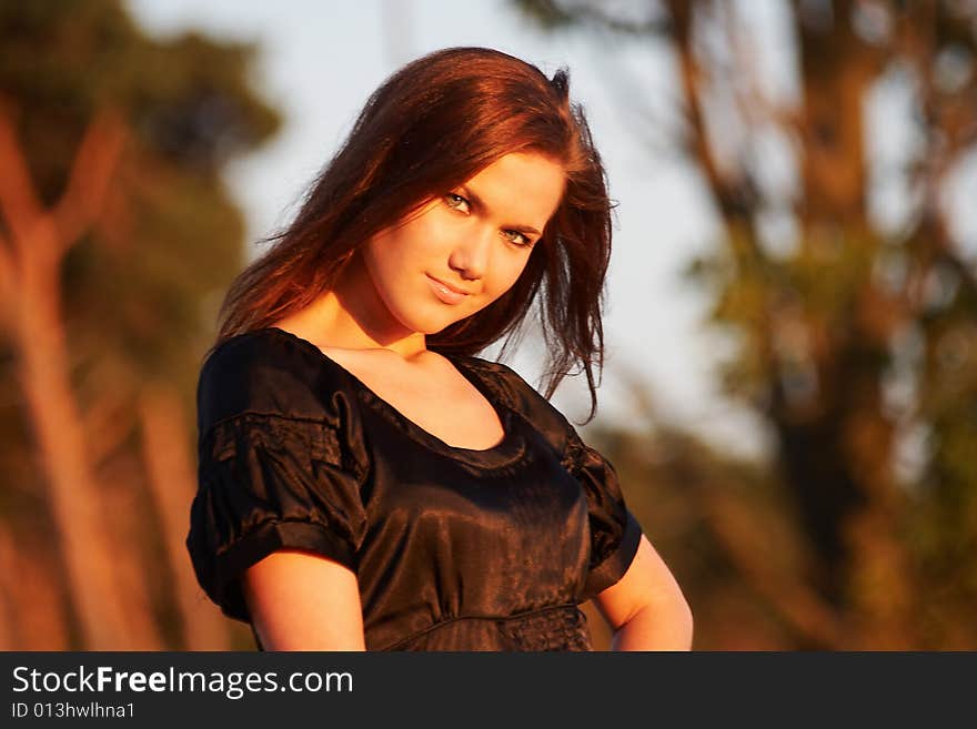 Portrait of a young lady in light of the evening sun