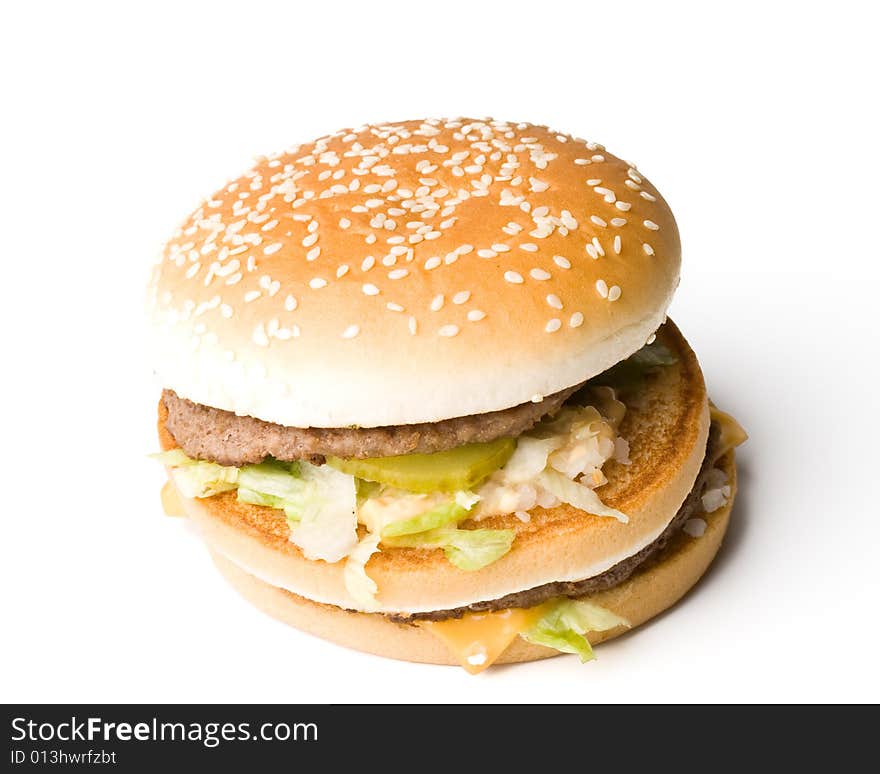 Bread with fried meat, cheese, onion and lettuce isolated on a  white background. Bread with fried meat, cheese, onion and lettuce isolated on a  white background.