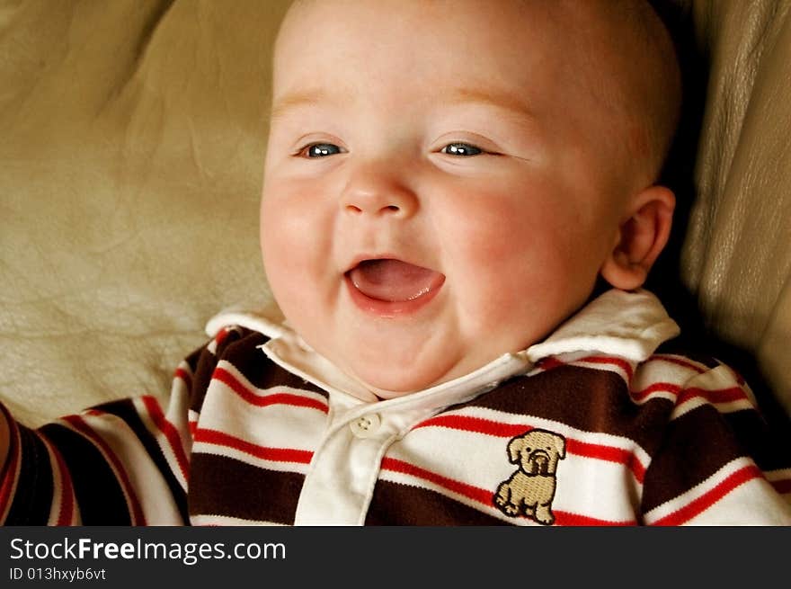 Beautiful, happy baby boy in a cute shirt. Beautiful, happy baby boy in a cute shirt