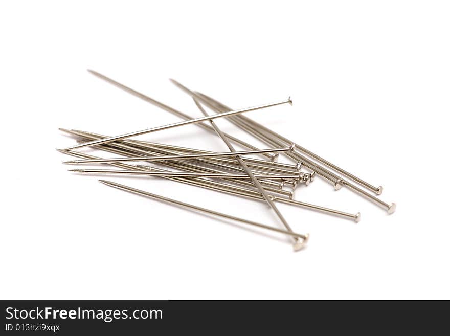 A pile of pins isolated on white background.