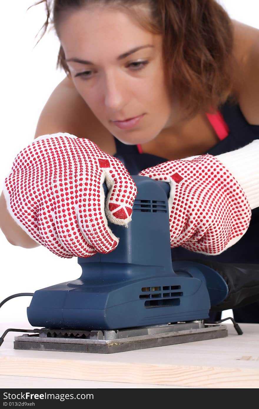 Woman carpenter at work on white background