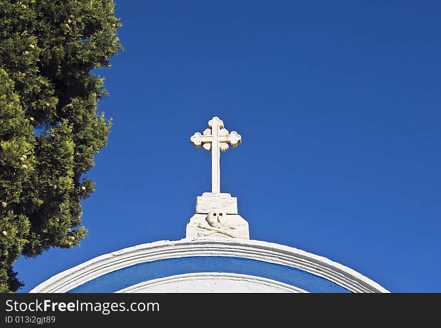 Marble cross over a cemetery entrance in Alentejo, Portugal