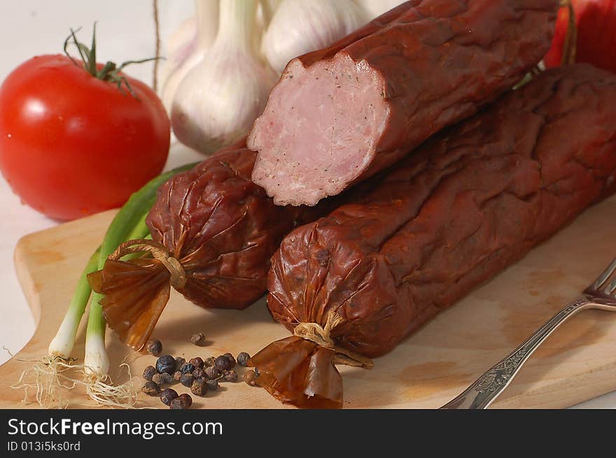 Baked sausage on the chopping board