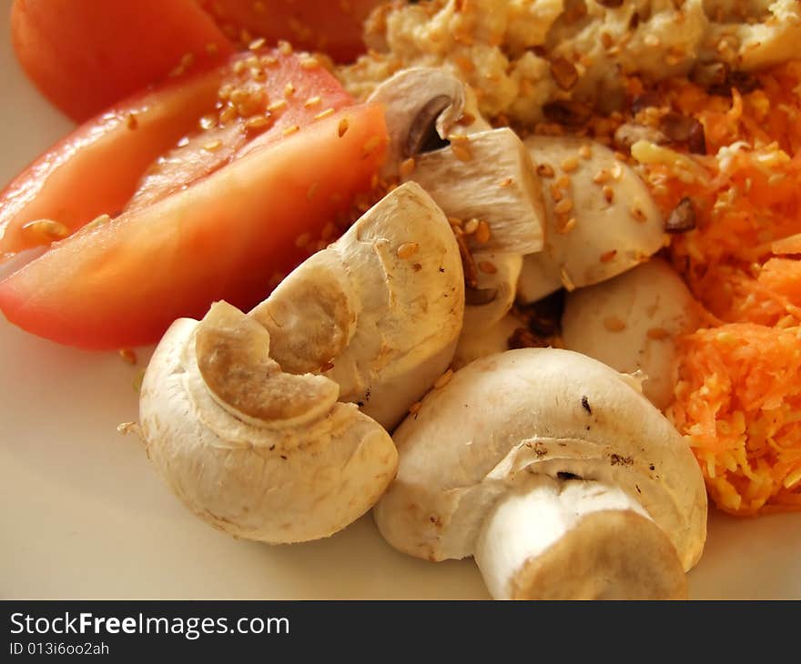 Prepared mixed vegetables on a white platter with hummus and mixed seeds. Prepared mixed vegetables on a white platter with hummus and mixed seeds.