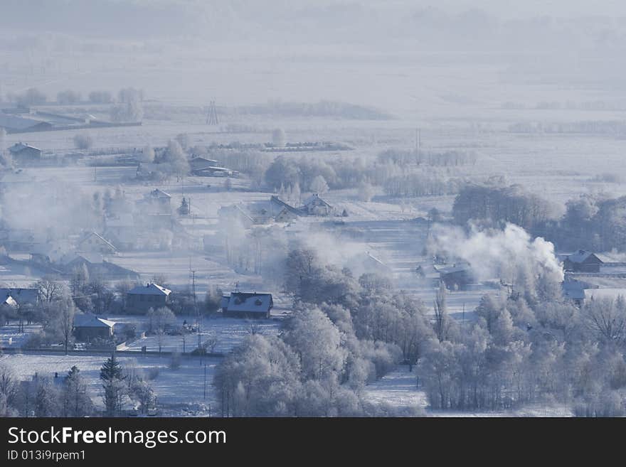 Small houses and trees in the snow. Small houses and trees in the snow