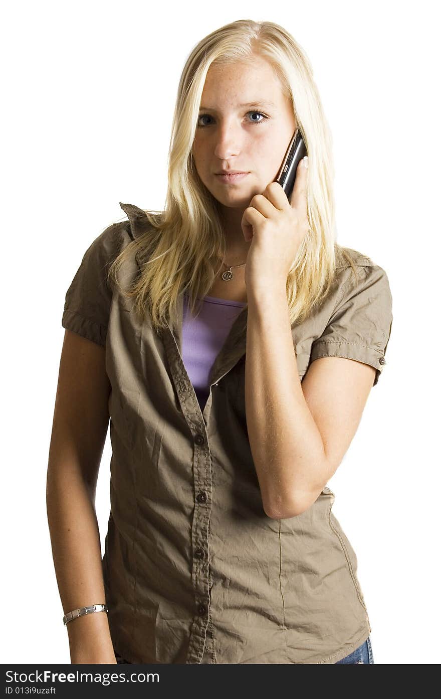 Blond teenage girl on the phone  isolated on a white background
