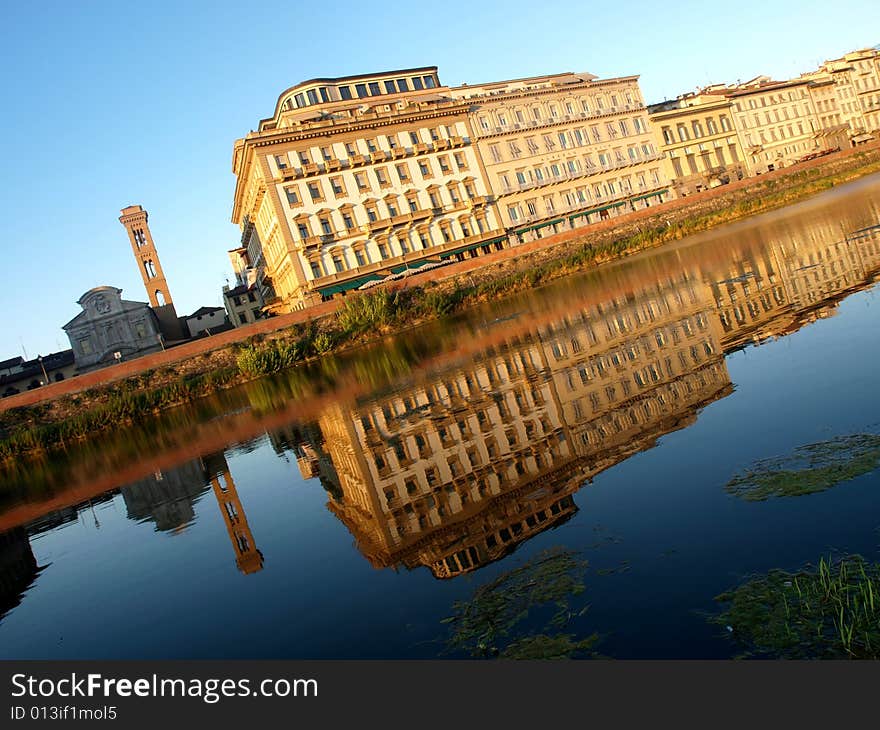 A wonderful landscape of some buildings reflected in the Arno river in Florence. A wonderful landscape of some buildings reflected in the Arno river in Florence