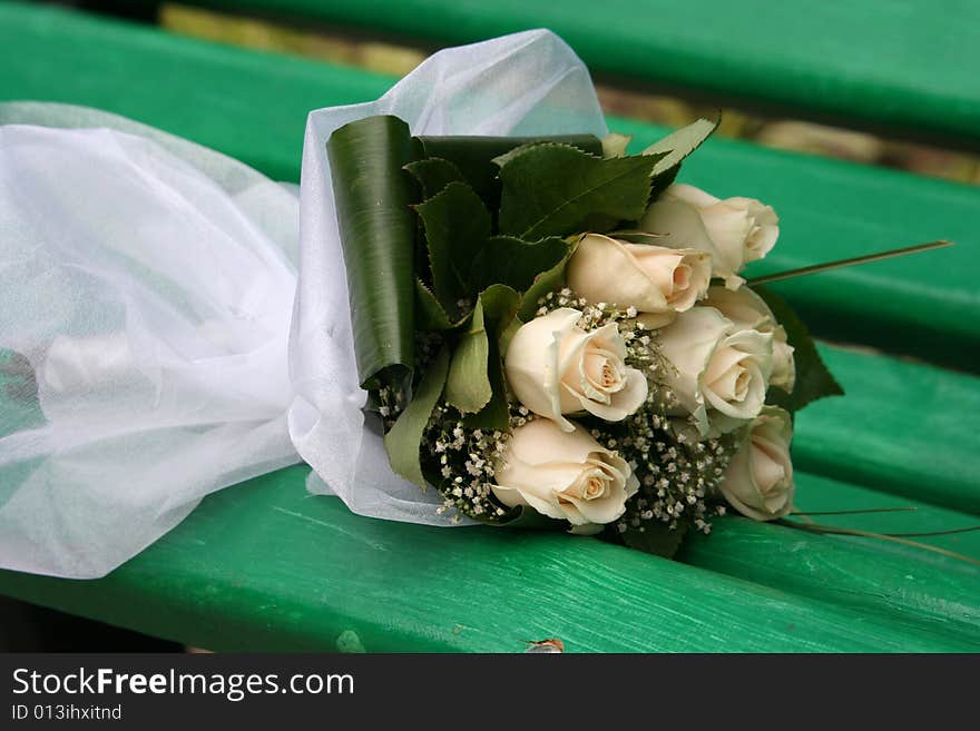 Wedding bouquet on the bench.