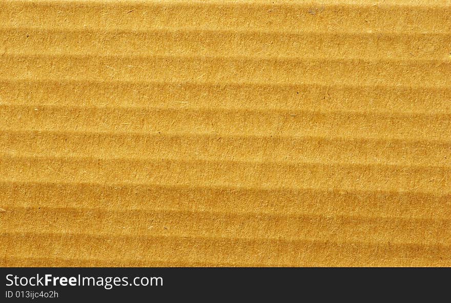 Brown corrugated cardboard sheet background. Brown corrugated cardboard sheet background