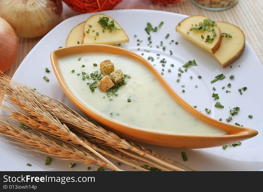 A fresh soup of potatoes with croutons