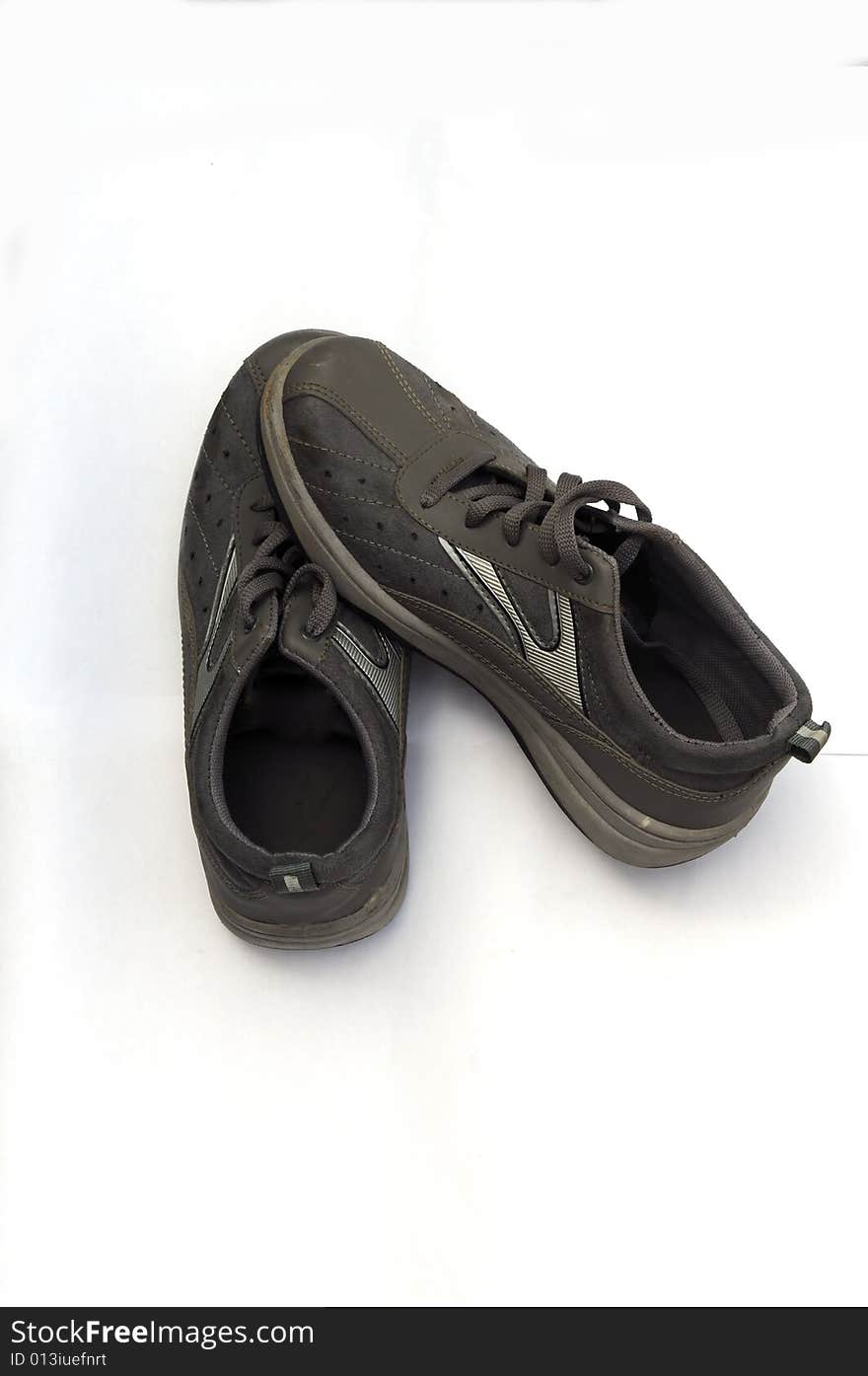 A pair of old black sports shoes