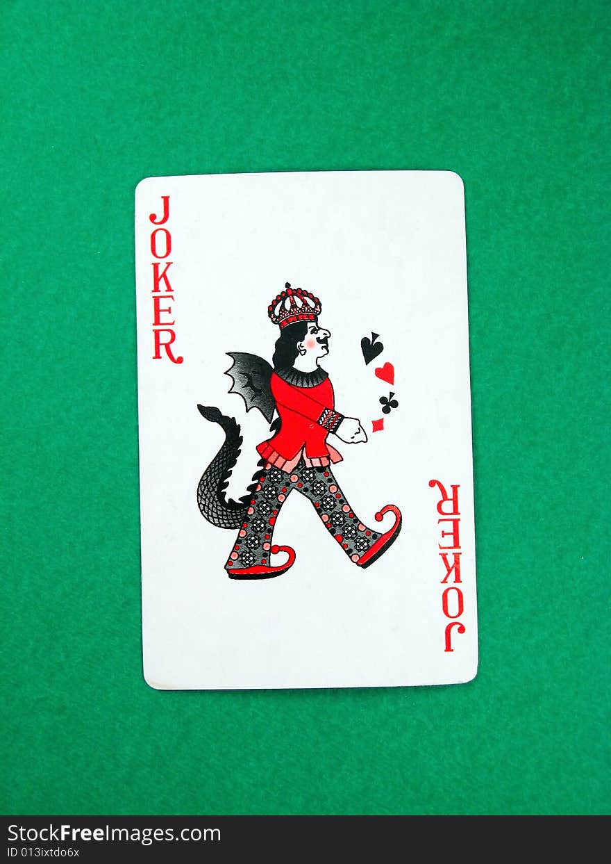 Joker fun poker gambling lucky card on green table