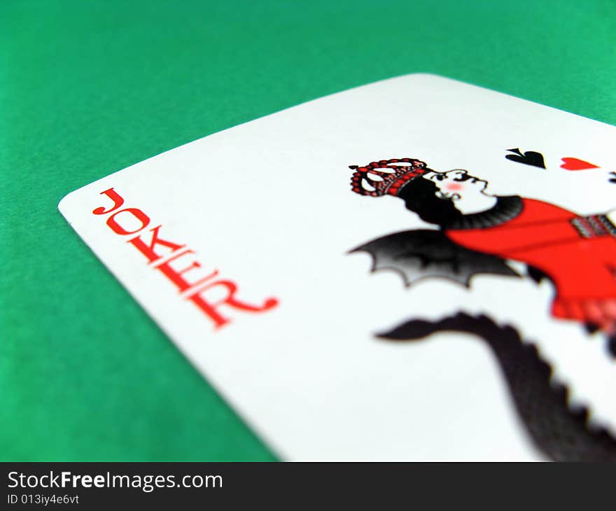 Joker fun poker gambling lucky card on green table