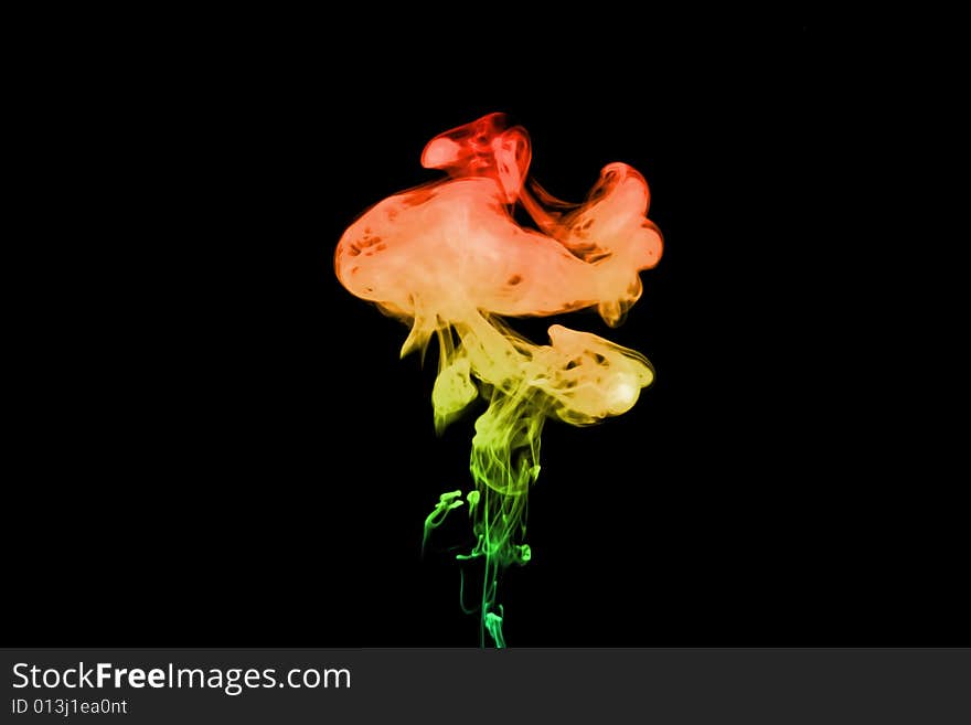 Puff of rainbow smoke. Isolated on black background