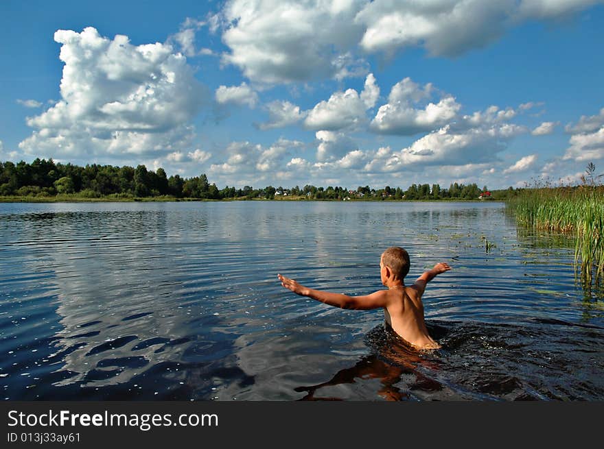 Boy Swimming In River