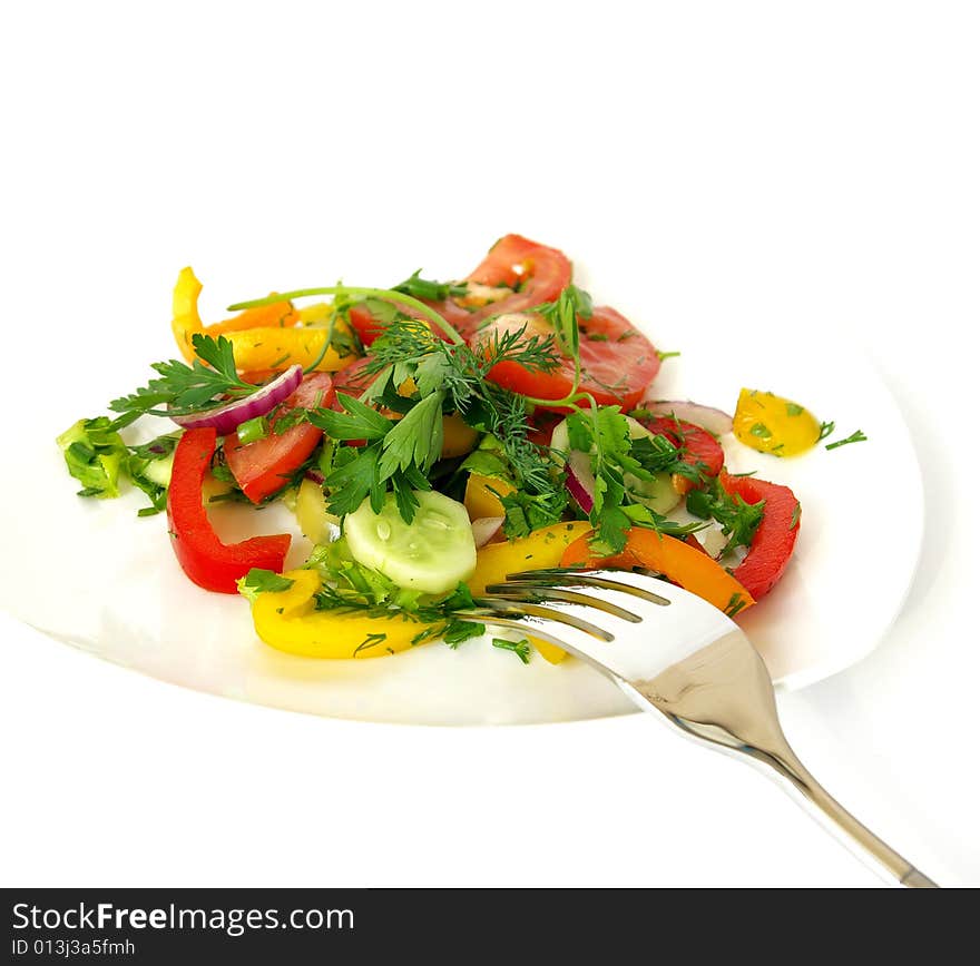 Freshness vegetarian salad and a fork isolated