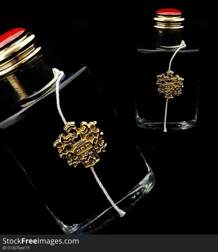 Two bottle ink on a black background