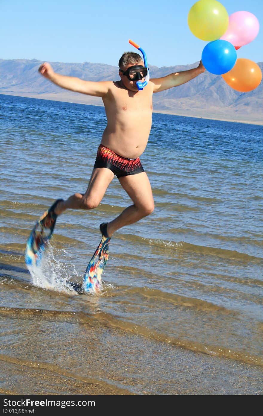 Cheerful man at vacation on sunny beach. Cheerful man at vacation on sunny beach