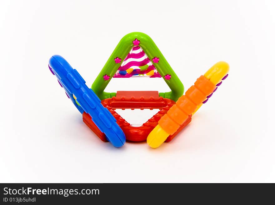 Colored plastic baby toy on a white background