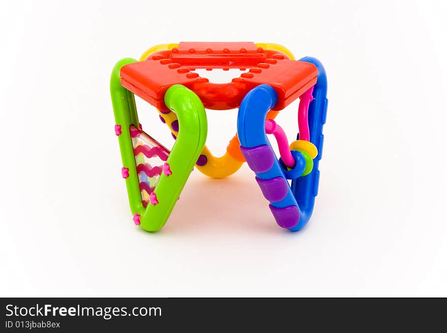 Colored plastic baby toy on a white background