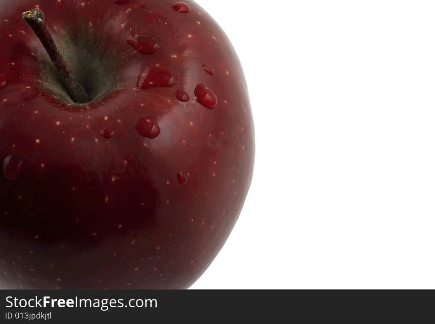 Macro image of a washed apple set against a white background. Macro image of a washed apple set against a white background