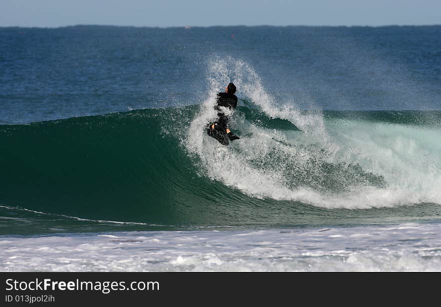 bodyboarder on top of the wave