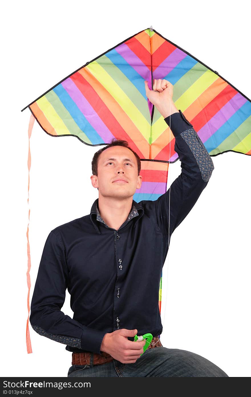 The man holds kite above head